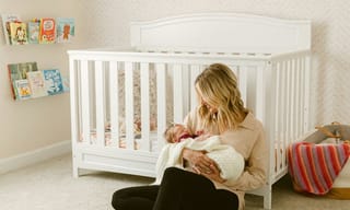 Mother sitting on the floor with her baby, enjoying clean air in a bright room