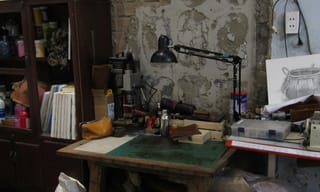 Organized craft room workspace with sewing machine and supplies