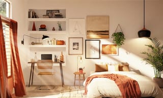 College dorm room with bed and desk lit by a window