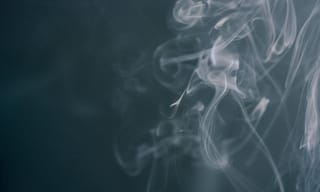 White smoke wisps rising against a dark background - Photo by Kseniya Budko on Pexels