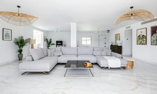 A bright, airy white modern living room with clean air and abundant natural light