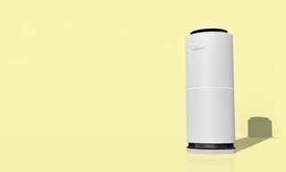 White cylindrical tower air purifier on a clean background