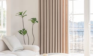 Sunlight streaming through a living room window on a hot summer day, with an air purifier running nearby