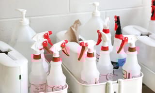 Household cleaning products and spray bottles, common sources of volatile organic compounds in homes