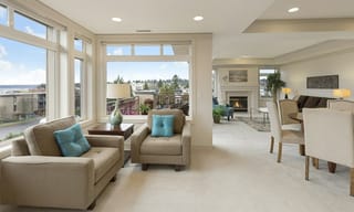 A bright open-plan living space with large windows and clean air