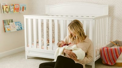 Mother sitting on the floor with her baby, enjoying clean air in a bright room