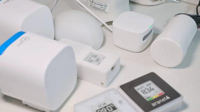 Affordable air quality monitor on a desk next to a window