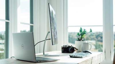 Clean bright desk workspace with natural light, ideal setting for a portable air purifier