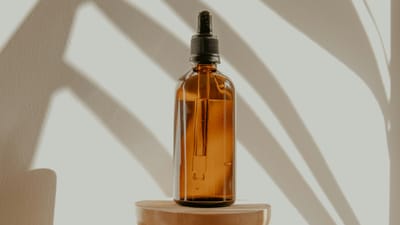 Essential oil diffuser releasing mist in a living room with soft natural light