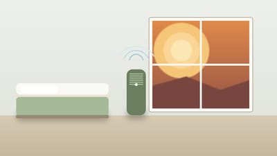 A sealed bedroom with an air purifier running during a smoky orange wildfire afternoon visible through the window