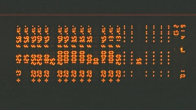 Close-up of a digital display showing numerical readings, similar to an air quality monitor screen