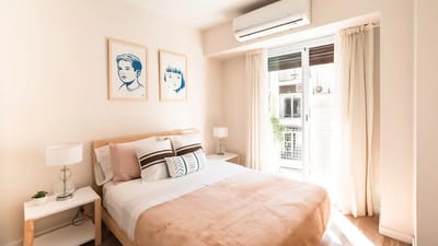 Air quality monitor next to a HEPA air purifier showing real-time PM2.5 readings