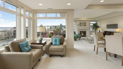 A bright open-plan living space with large windows and clean air