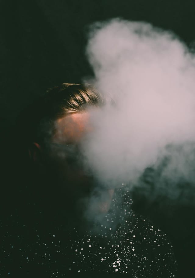 White vapor cloud rising against a dark background - Photo by Luemen Rutkowski on Pexels