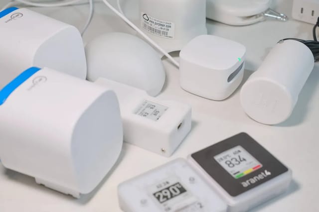 Affordable air quality monitor on a desk next to a window