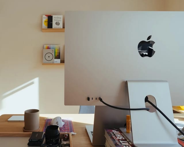 CO2 monitor displaying air quality readings on a home desk