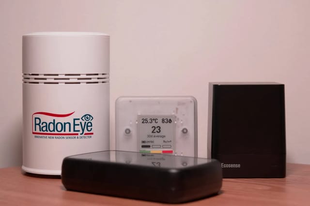 Radon detector displaying readings in a home basement