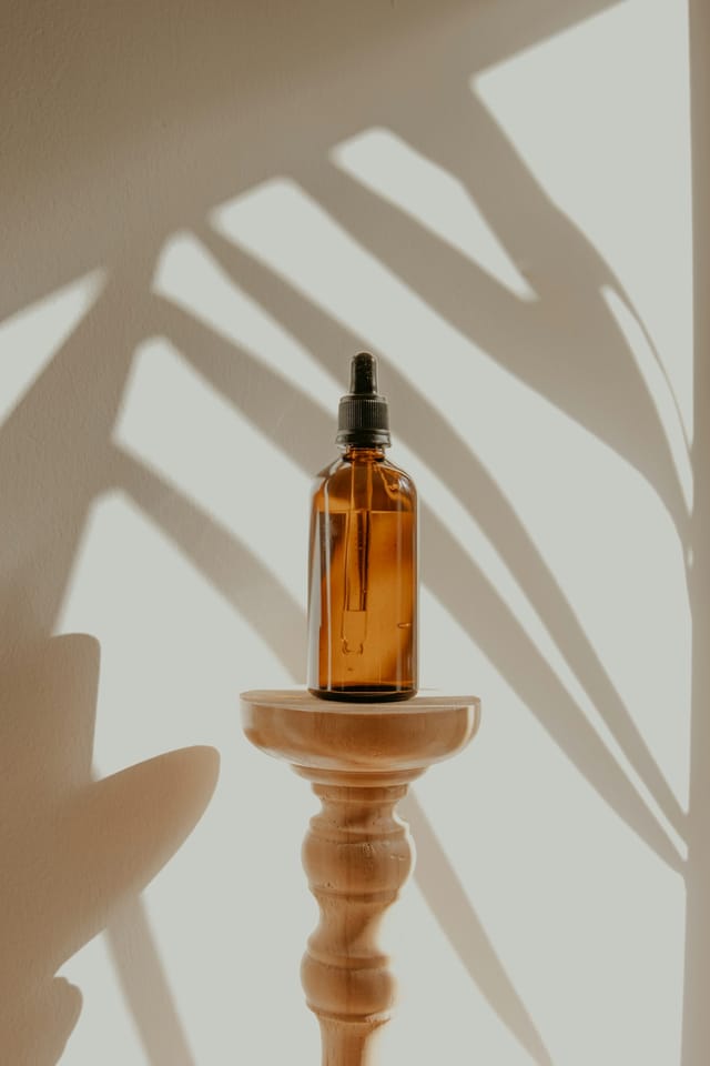 Essential oil diffuser releasing mist in a living room with soft natural light