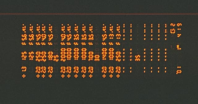Close-up of a digital display showing numerical readings, similar to an air quality monitor screen