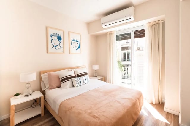 Air quality monitor next to a HEPA air purifier showing real-time PM2.5 readings