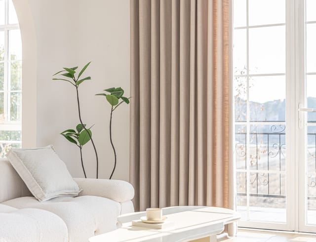 Sunlight streaming through a living room window on a hot summer day, with an air purifier running nearby
