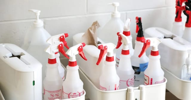 Household cleaning products and spray bottles, common sources of volatile organic compounds in homes