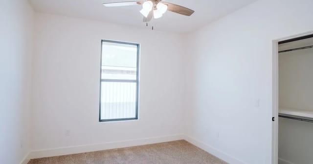 Bright room interior with ceiling fan and window, showing an ideal open space for air quality monitor placement